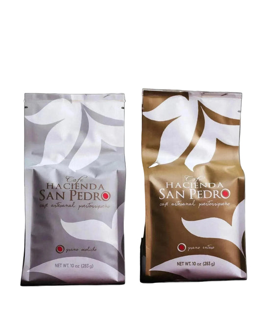 Two coffee bags from Hacienda San Pedro on a wooden surface with a blurred background.